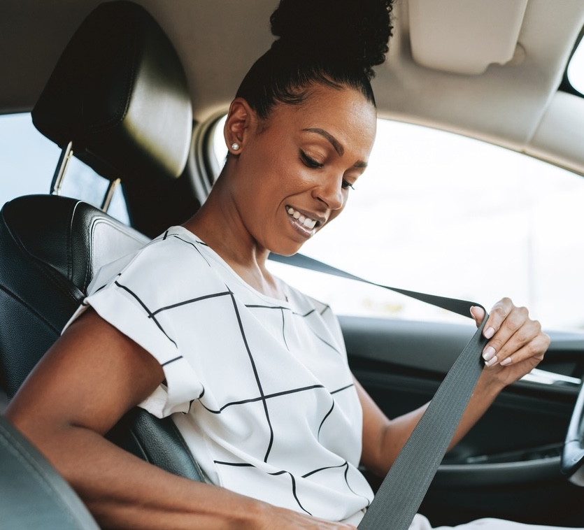 Woman putting on safety harness
