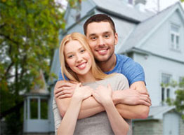 Home Insurance - Couple in Front of House